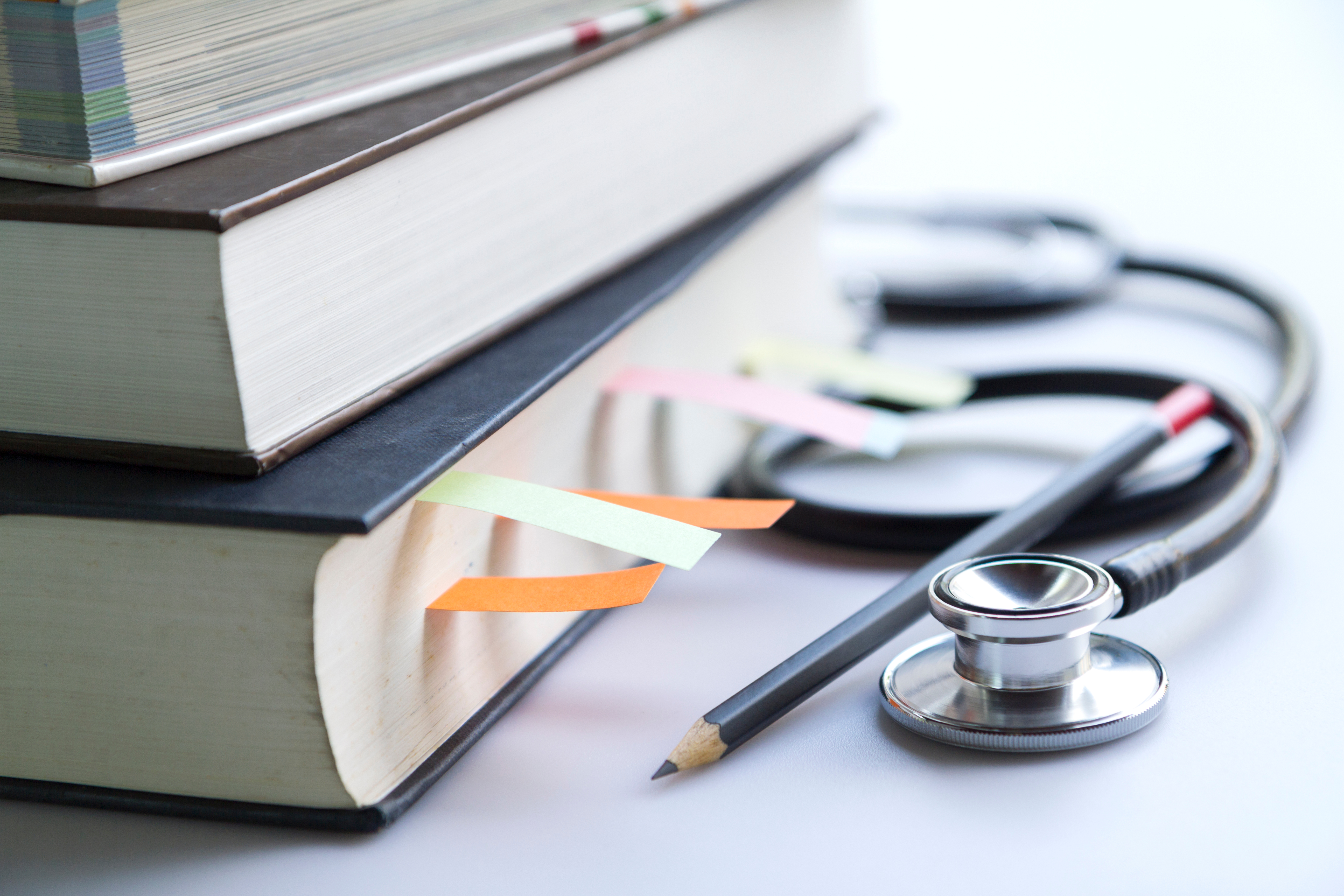 Books and a stethoscope 